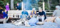 Guests relaxing by the campfire after a good day of experiencing Desolation Sound