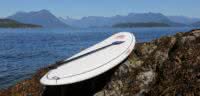 A stand up paddle board on a rock at our resort in Desolation Sound